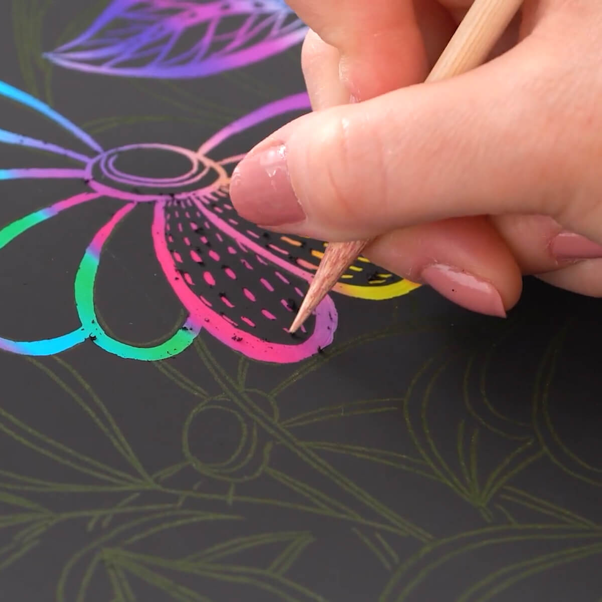 Photo of person doing scratch art