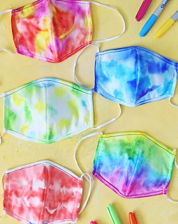 Five multi-hued tie dyed masks.