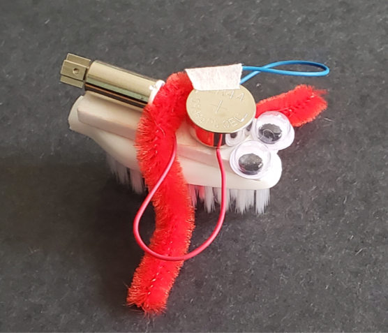 small robot made from a toothbrush and a vibrating motor