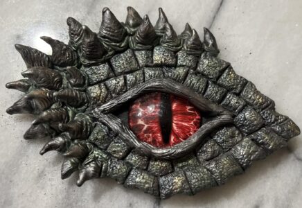 Image of a dragon eye made out of polymer clay and glass