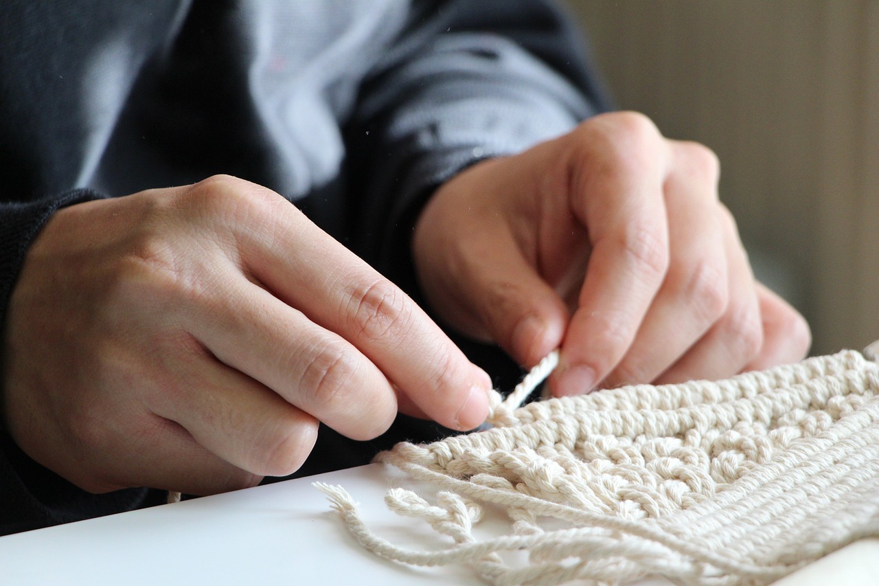 hands crafting macrame