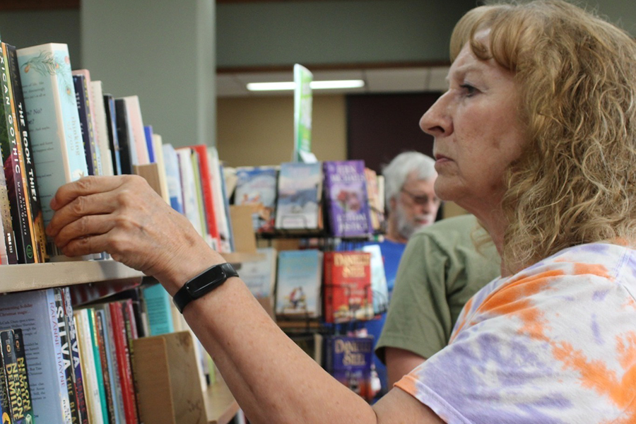 Woman browsing books in the library