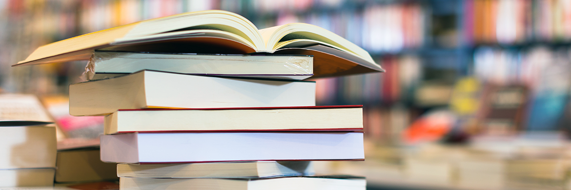 stack of books, with the top book open