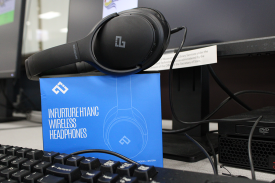 Headphones sitting on a computer desk