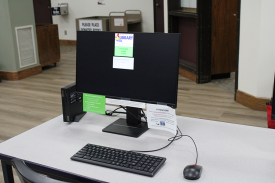 Desktop computer with notes placed on screen