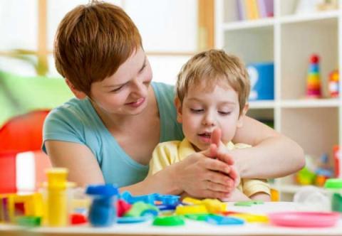 Kid with mom making craft
