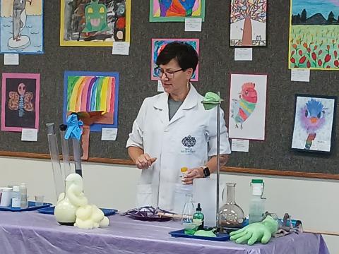 Mad Scientist with beakers & tubes on table