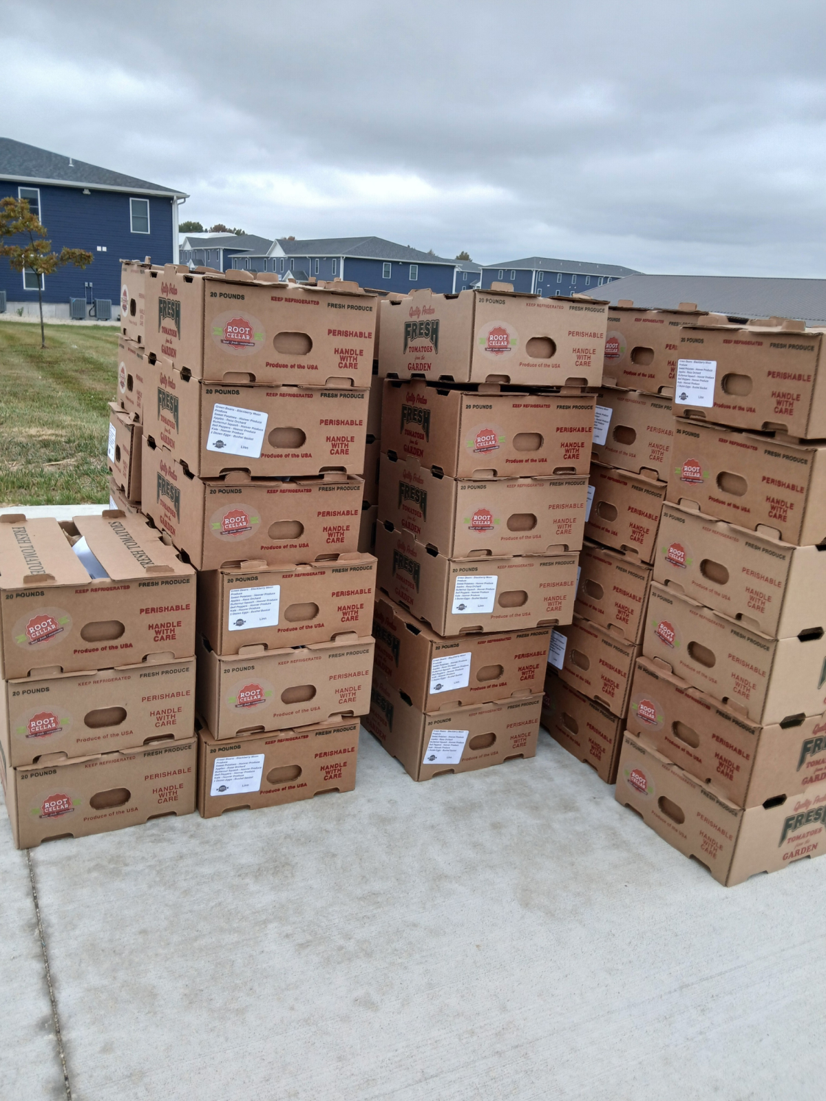 stack of produce boxes on library parking lot