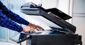 person scanning a document in an office