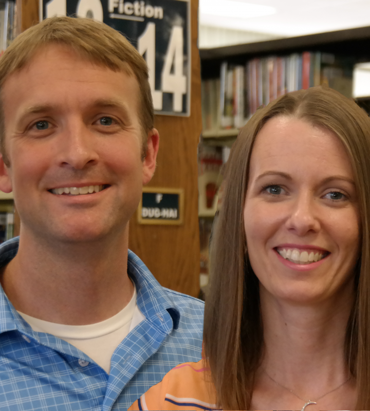 Man and woman in library stacks