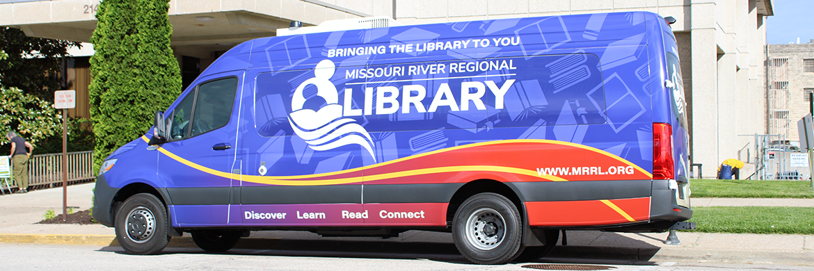 Book Sprinter Van parked in front of the library